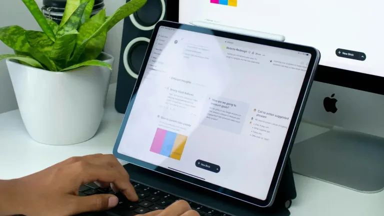 Structured service overview on a laptop with organised notes
