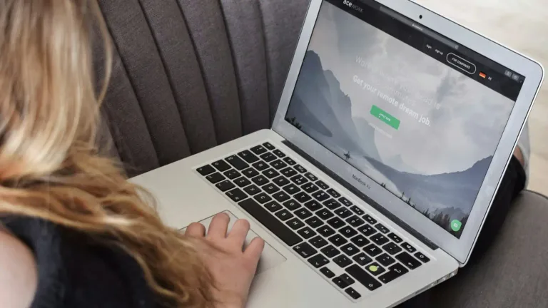 Person using a contact form on a laptop